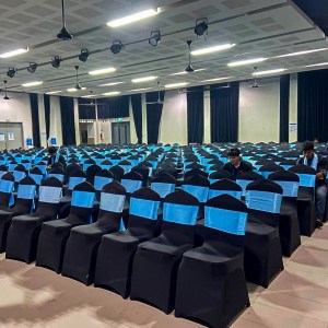 Chair with black cover and sky blue ribbon