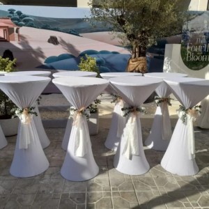 Cocktail table with white ribbon and flower