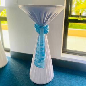 Cocktail table with white cover and light blue ribbon